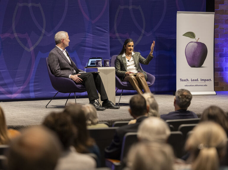 Dr. Vischer and Dr. Hansen seated in the OEC auditorium at the February 2026 Finding Forward event