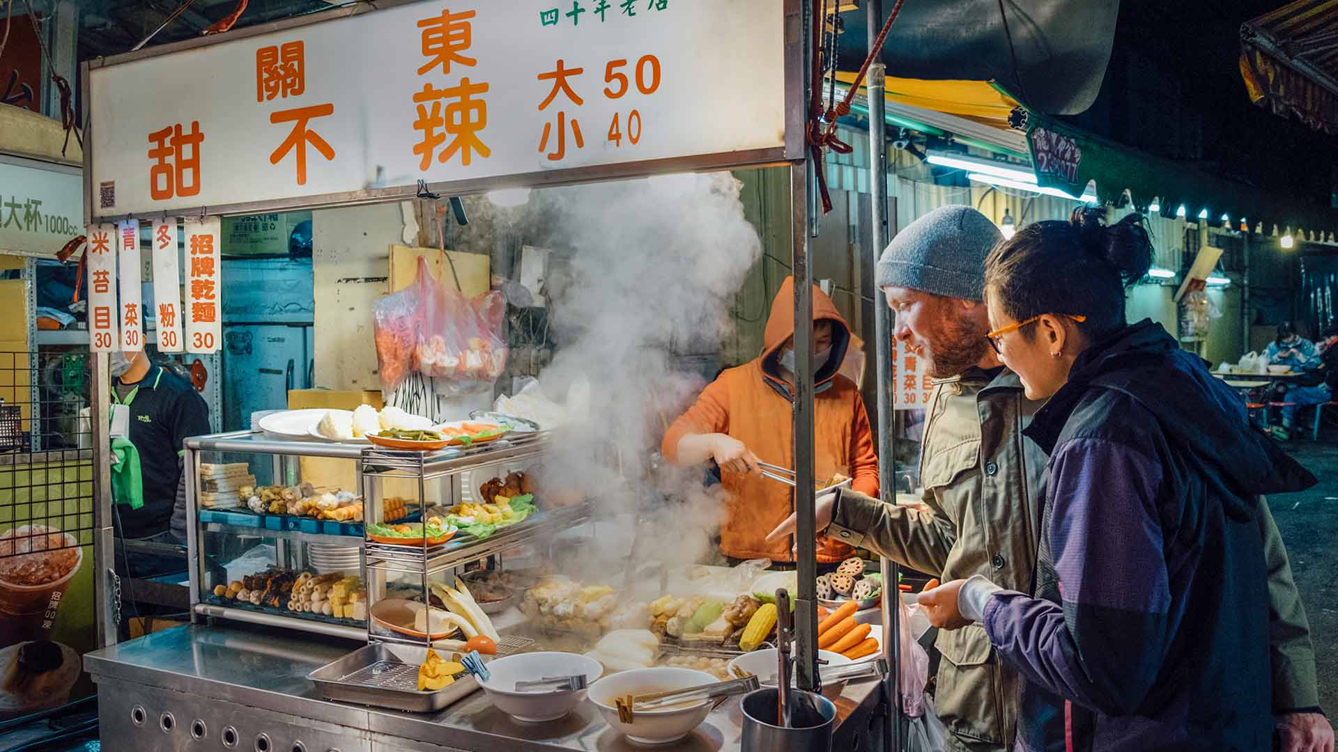 Taiwanese street vendor selling food to customers