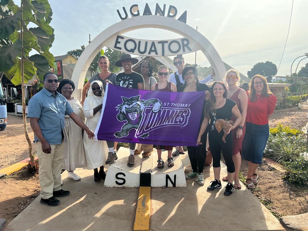 Group photo of St. Thomas students at the Equator